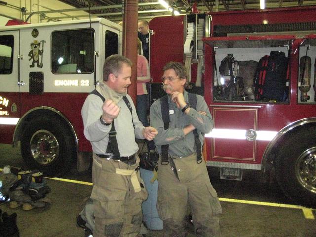 Doug preforming air band "They Call Me the Fireman"